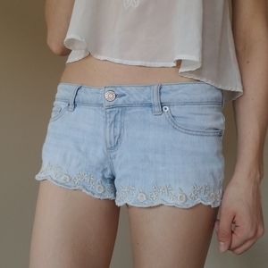 Jean shorts with embroidered floral hem